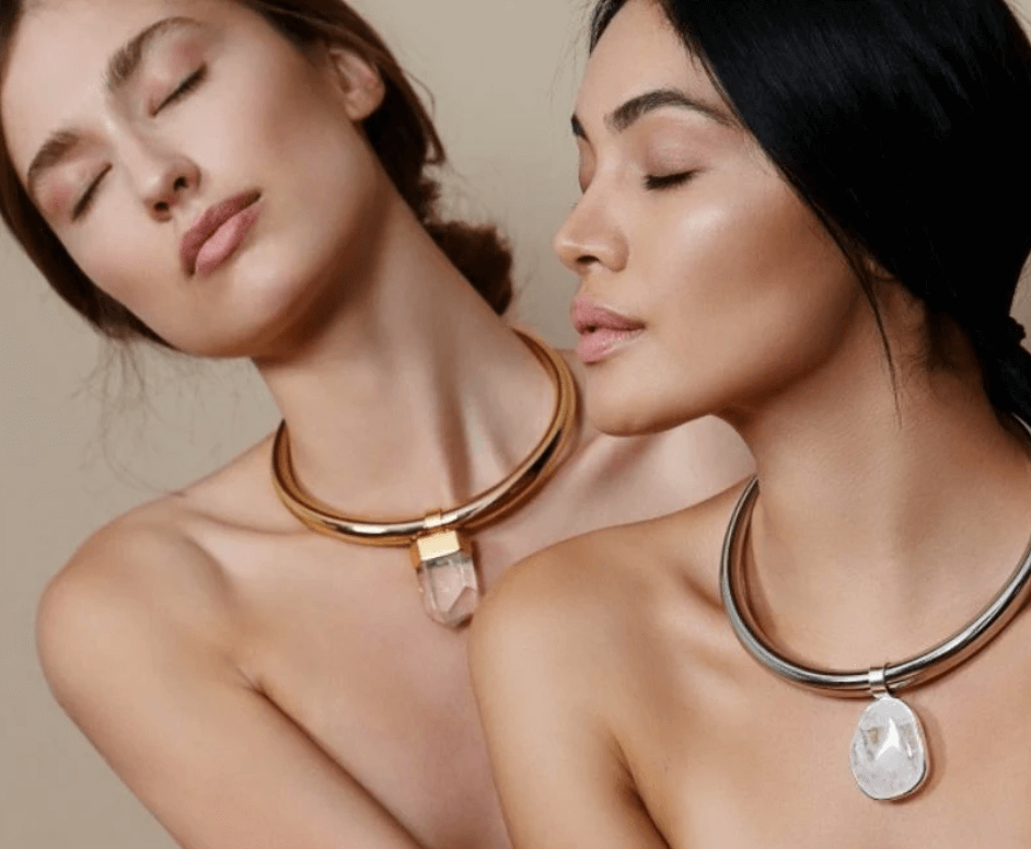TOHUM necklaces on models.