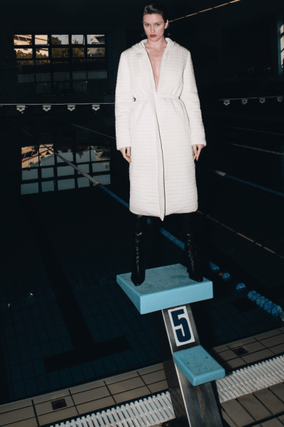 Stefania Vaidani coat being modeled in pool.
