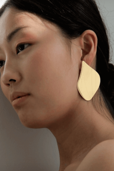 MARAMZ’s golden Madison earrings.